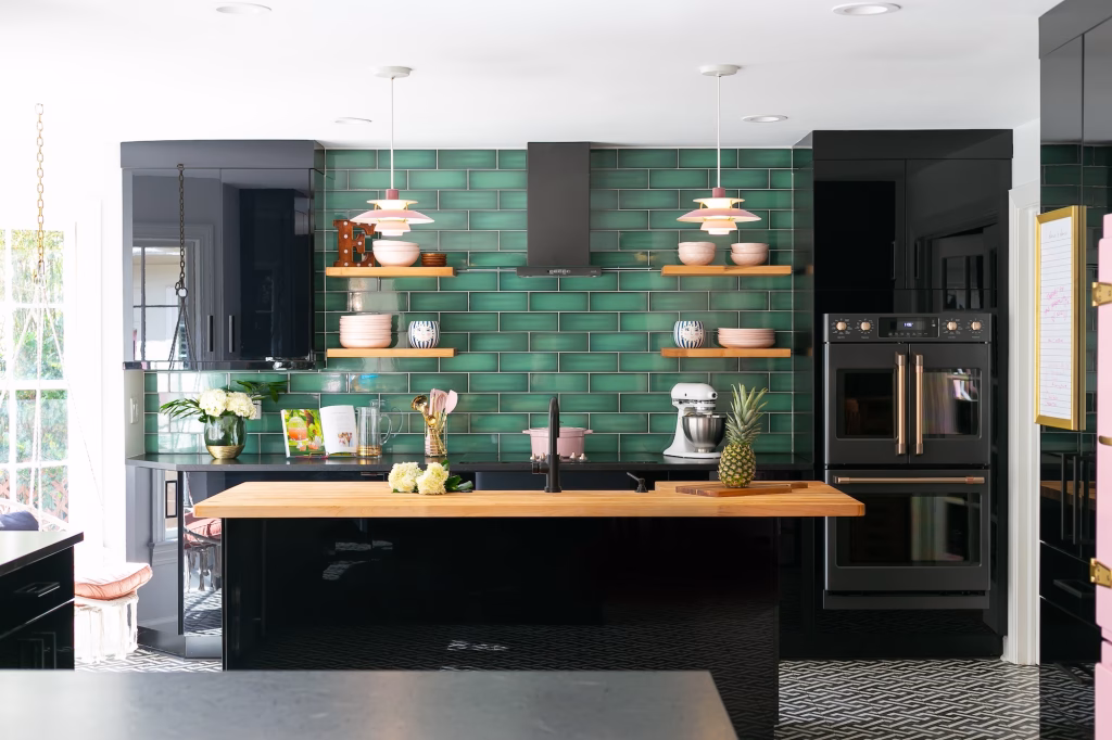 Glossy black kitchen cabinetry in a Charleston home renovation